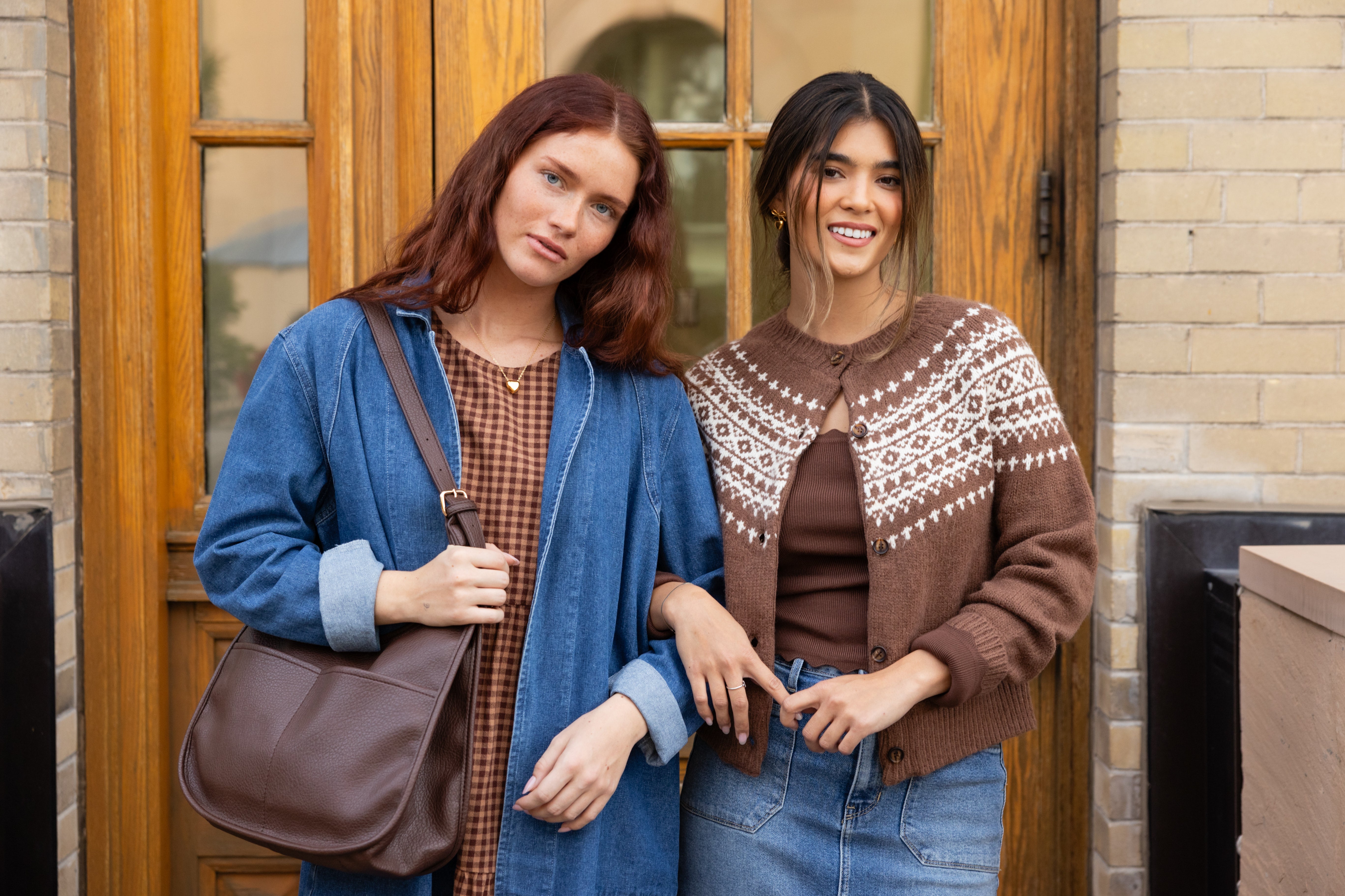 women wearing fall outfits with a dress and cardigan