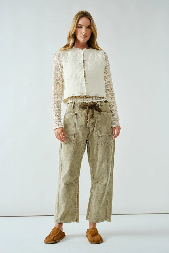 Light brown corduroy pants with a drawstring on a white background