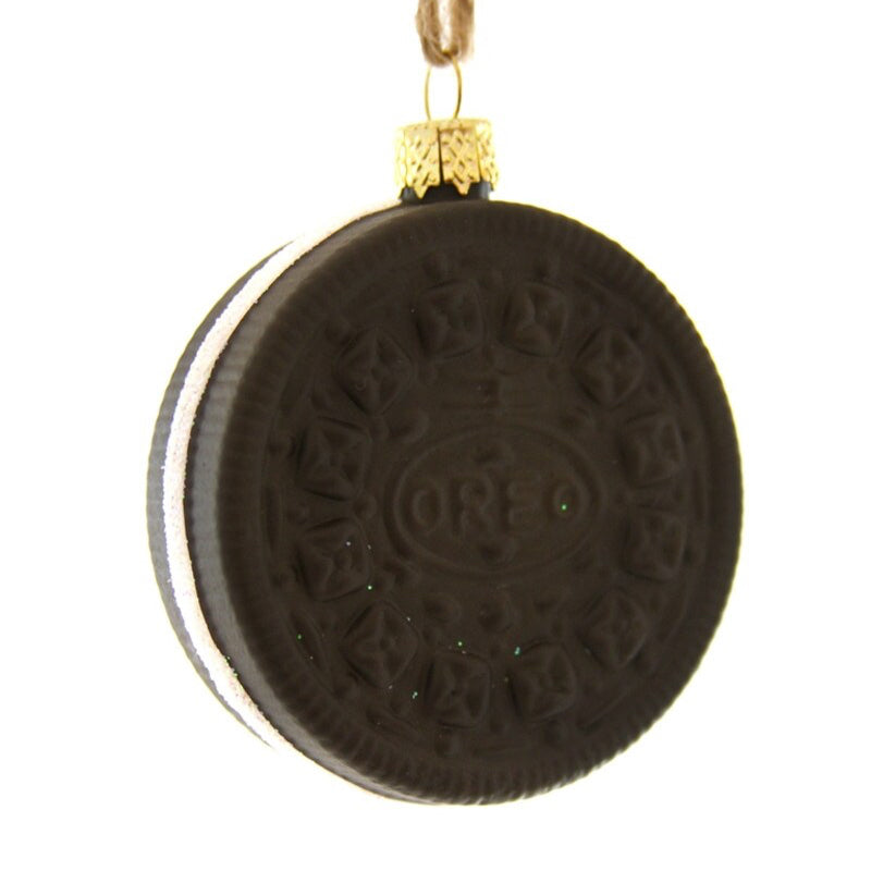 Decorative Oreo cookie ornament with a gold chain on a white background