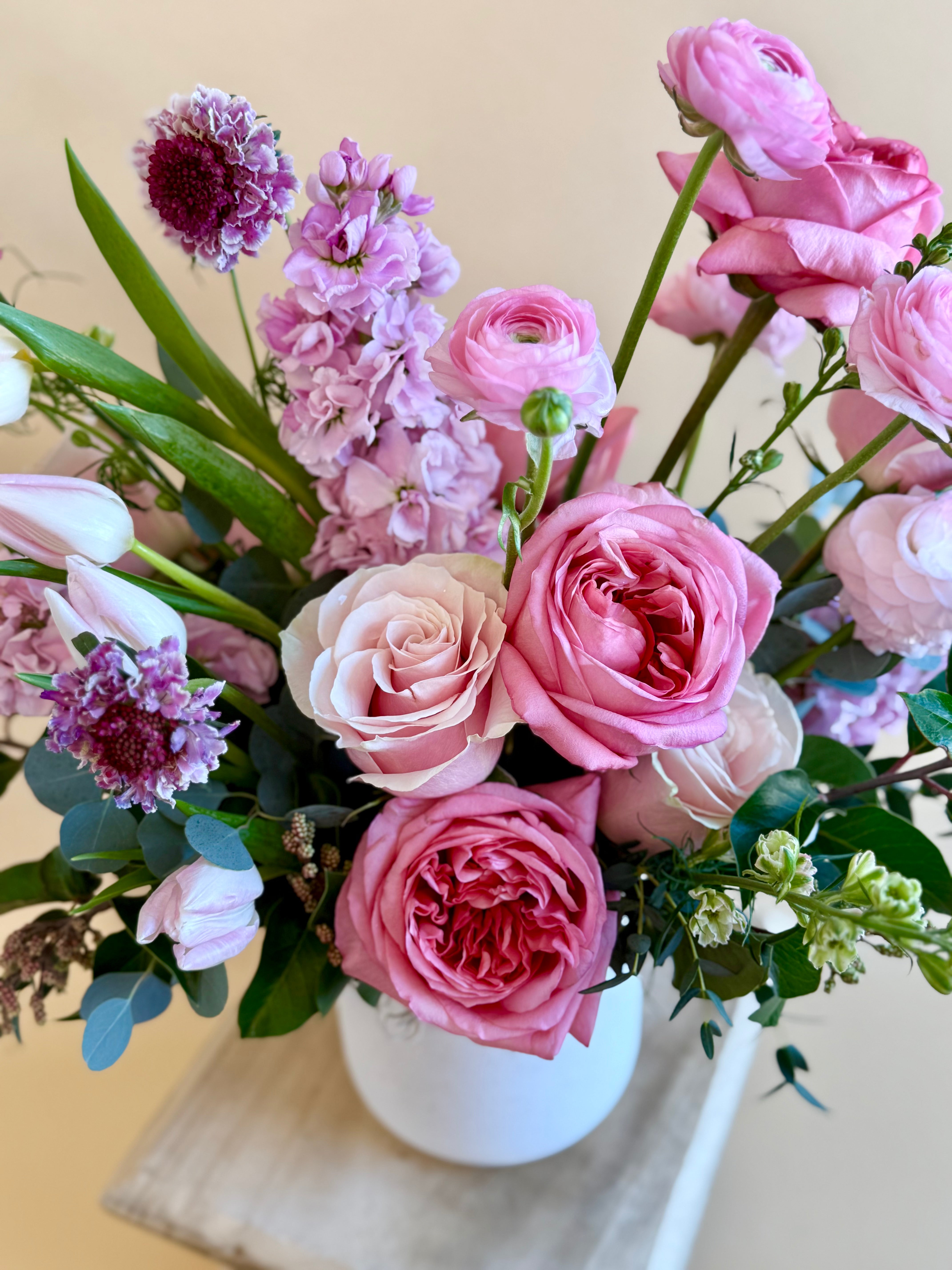 Purple and pink floral vase arrangement