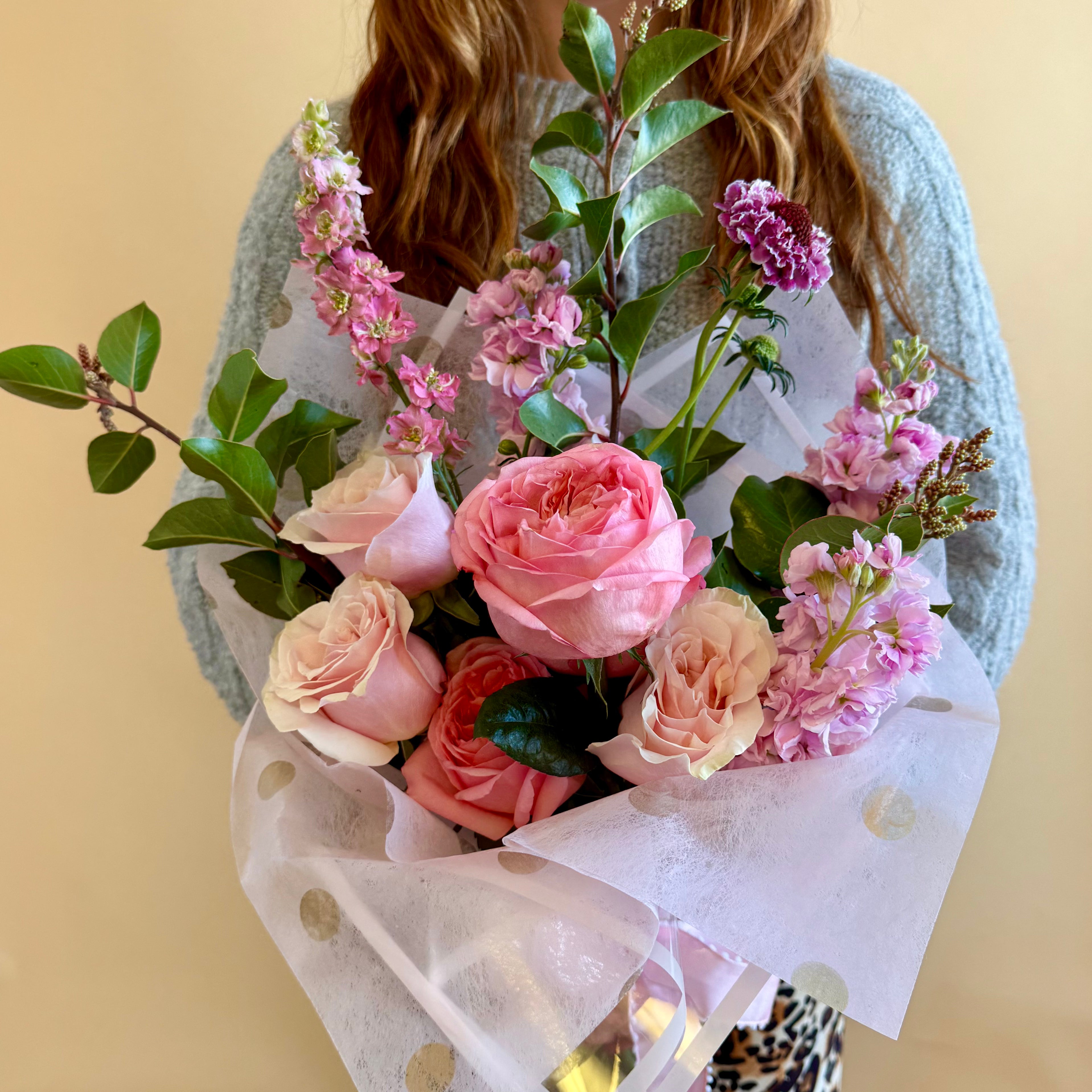 Purple and pink floral bouquet loose wrap arrangement