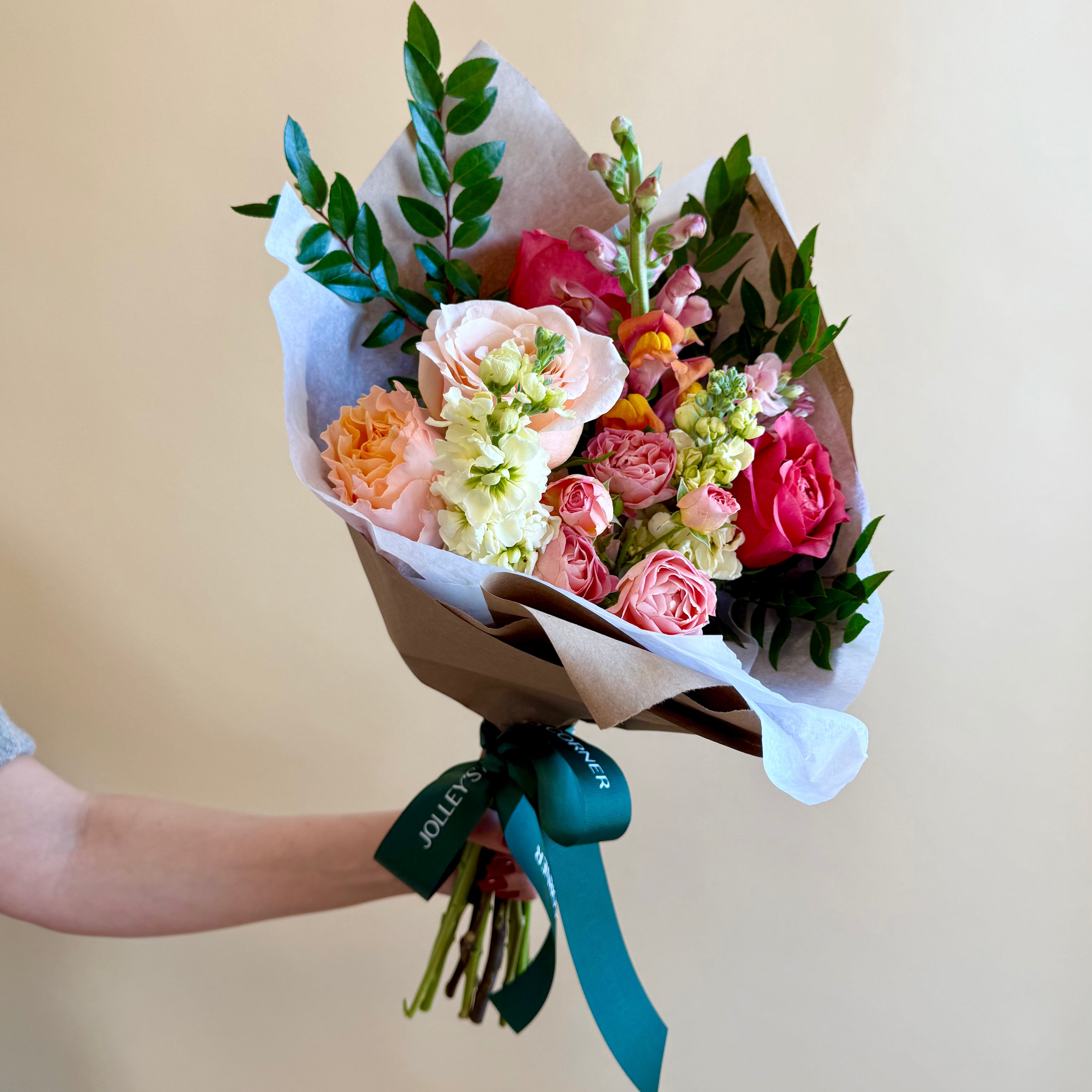 Bright pink and orange floral bouquet arrangement