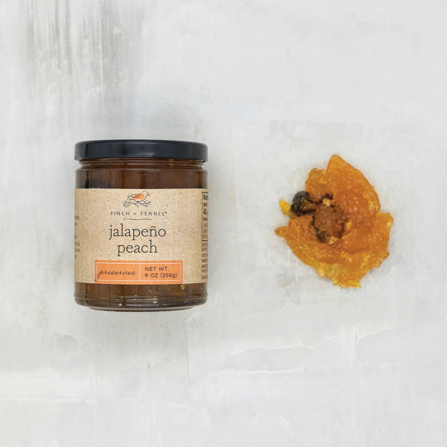 Product shoot of jalapeno peach preserve.