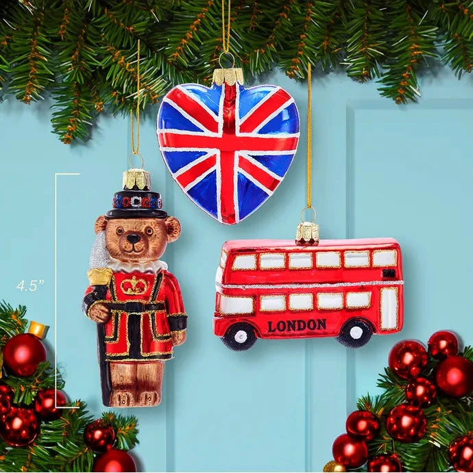Christmas ornaments including a bear, heart with Union Jack design, and London bus on a blue background.