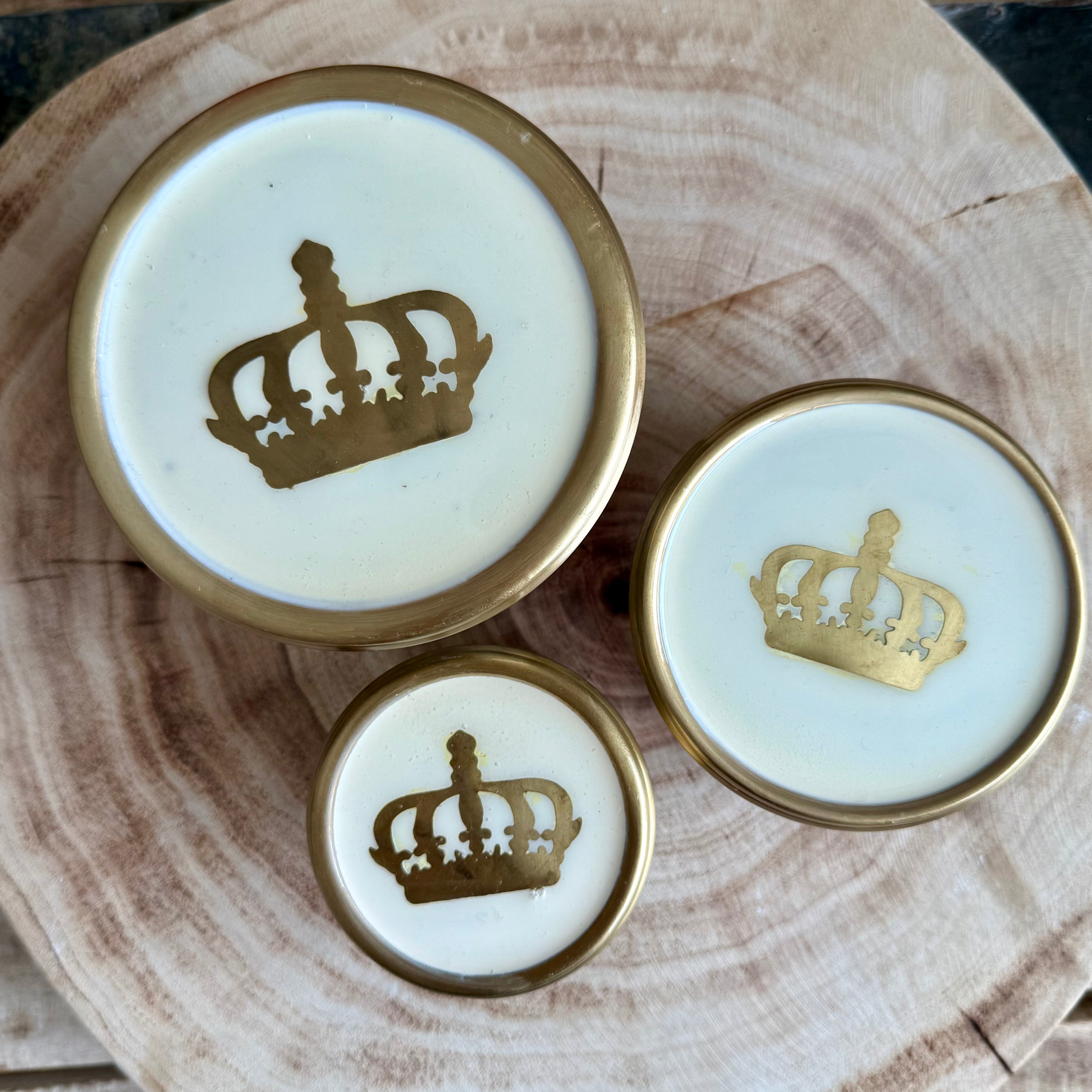 Product shoot of gold and glass crown jar.