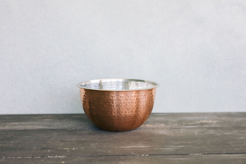 Product shoot of different sizes of the hammered copper bowl.