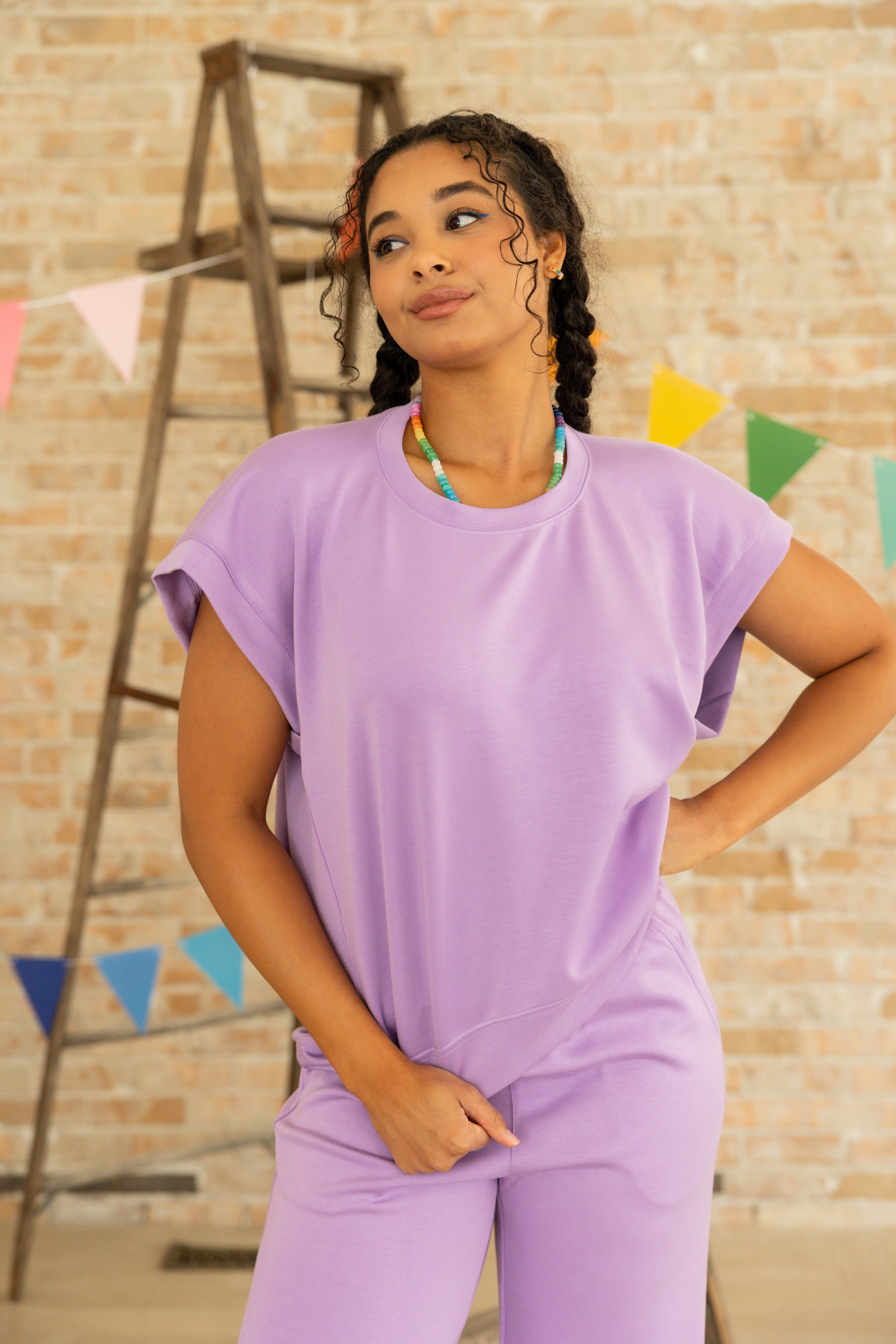 Model is wearing lavender short sleeve and pant lounge set.