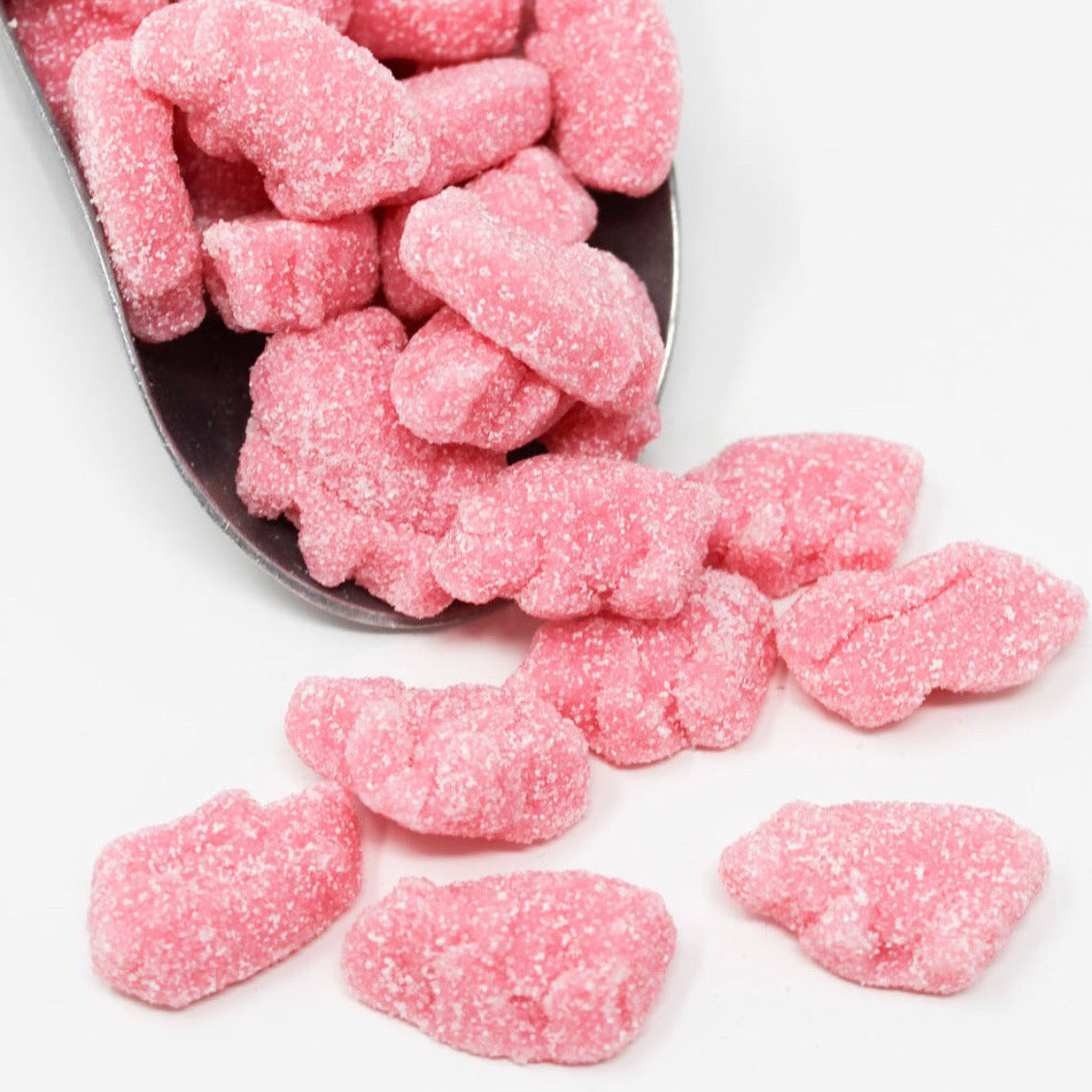 Sour raspberry piggies in a scoop.