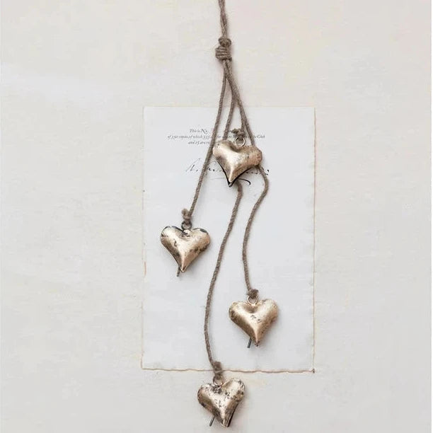 Decorative hanging heart ornament on a white background