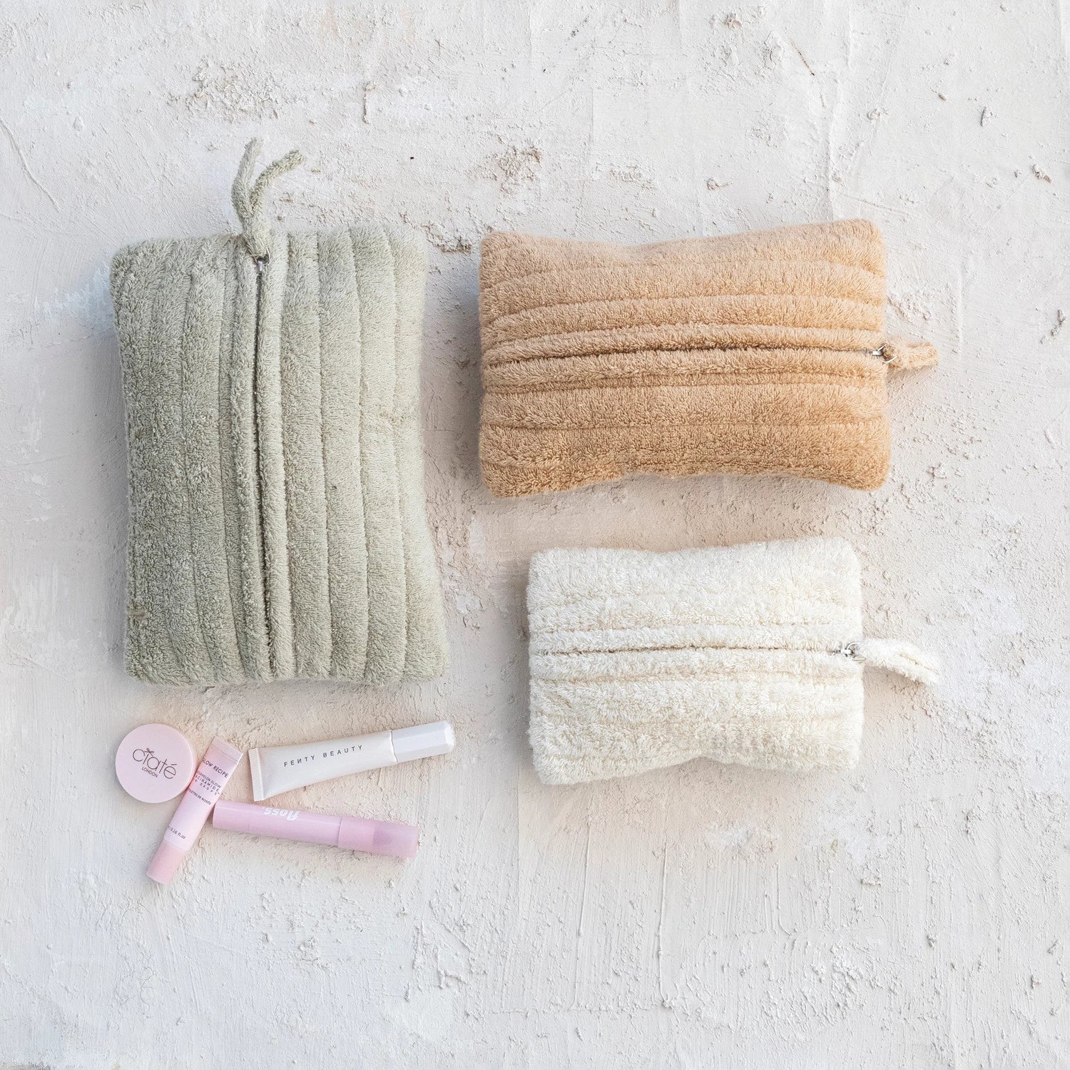 Product shoot of quilted cotton terry zip pouches.