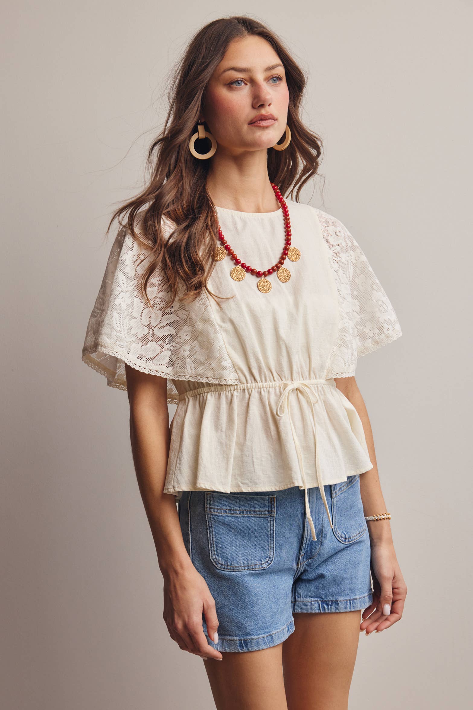 The Iris Peplum Top