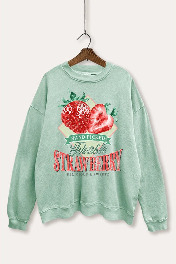 Green sweatshirt with strawberry graphic and text on a white background