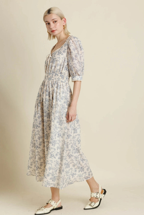 Woman wearing a floral dress on a beige background
