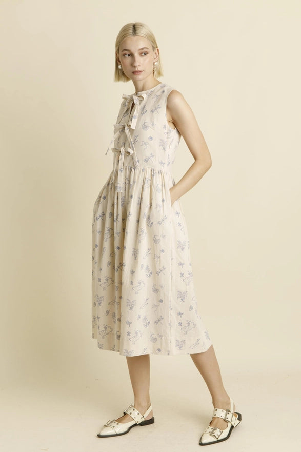 Woman wearing a floral dress on a beige background