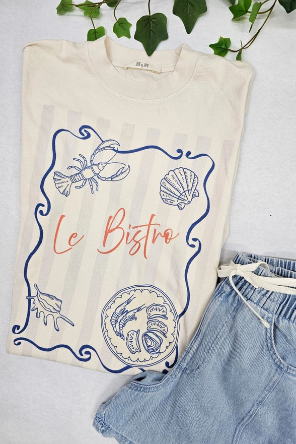 T-shirt with 'Le Bistro' design and denim shorts on a light background