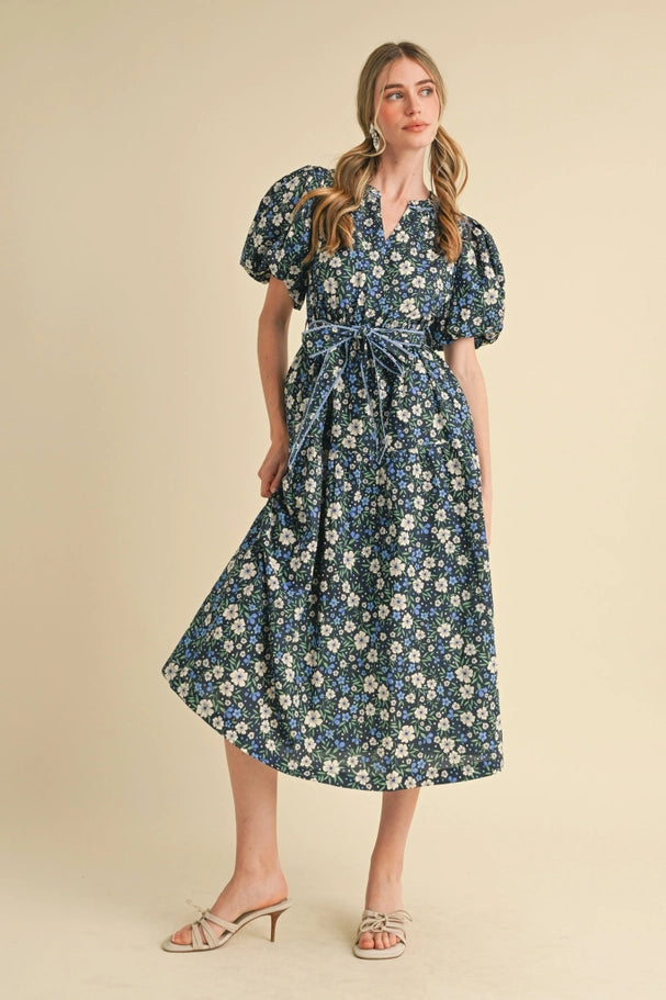 Woman wearing a floral dress on a beige background