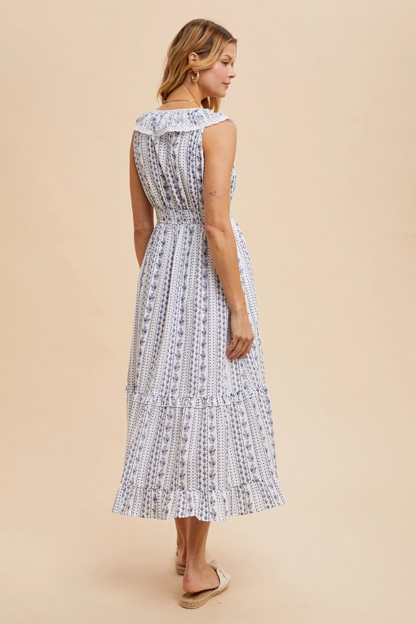 Woman wearing a patterned dress on a beige background