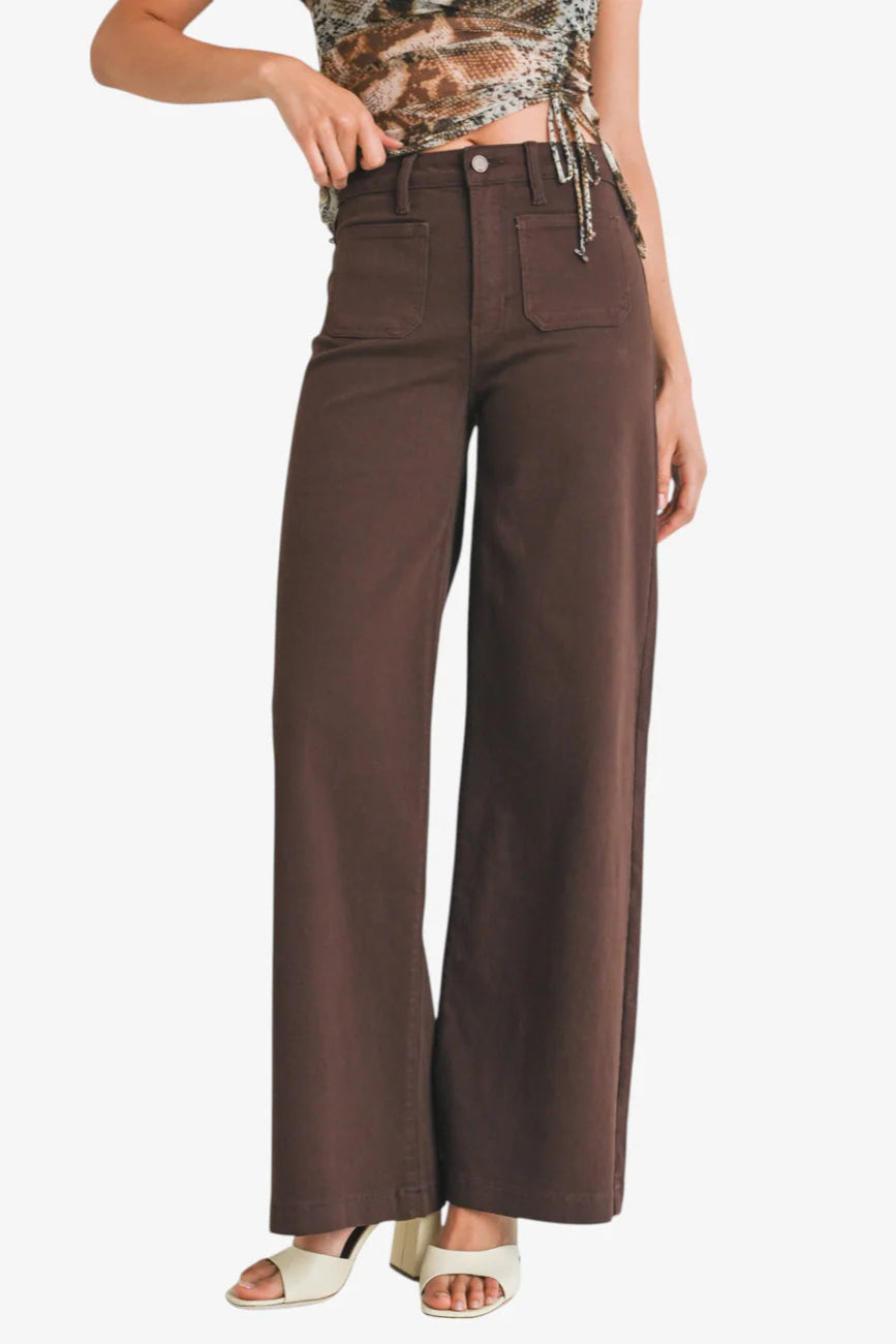 Brown wide-leg pants worn by a person on a white background
