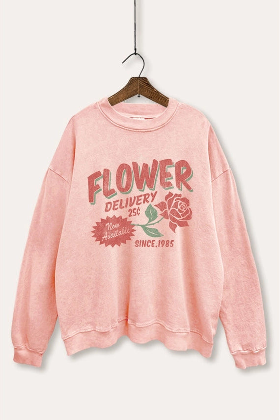 Pink sweatshirt with 'Flower Delivery' text and rose graphic on a white background