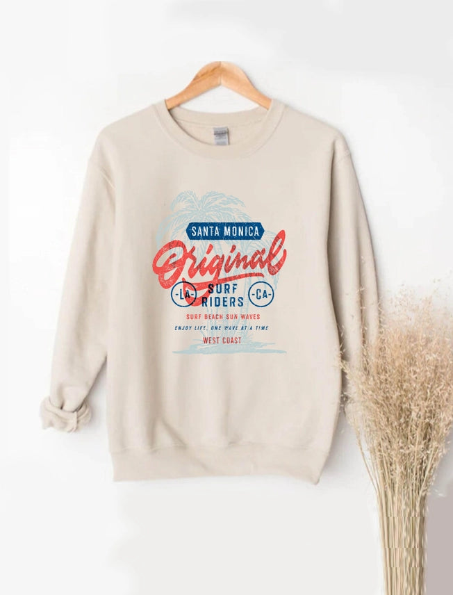Beige sweatshirt with graphic design on a hanger against a white background