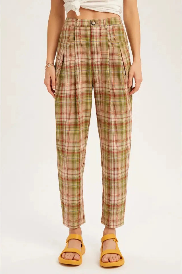 Plaid pants worn by a person on a white background