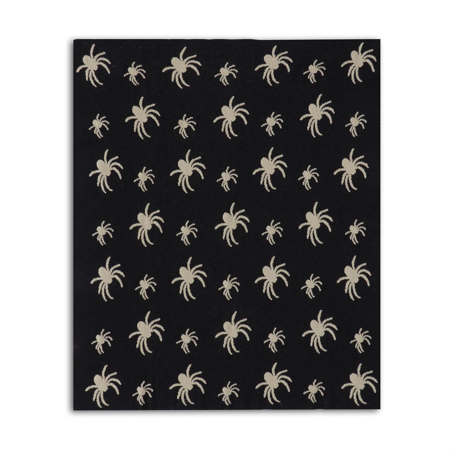 Black fabric with beige spider pattern on a white background