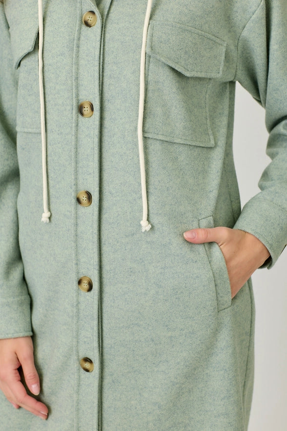 Green coat with buttons and a hood on a plain background