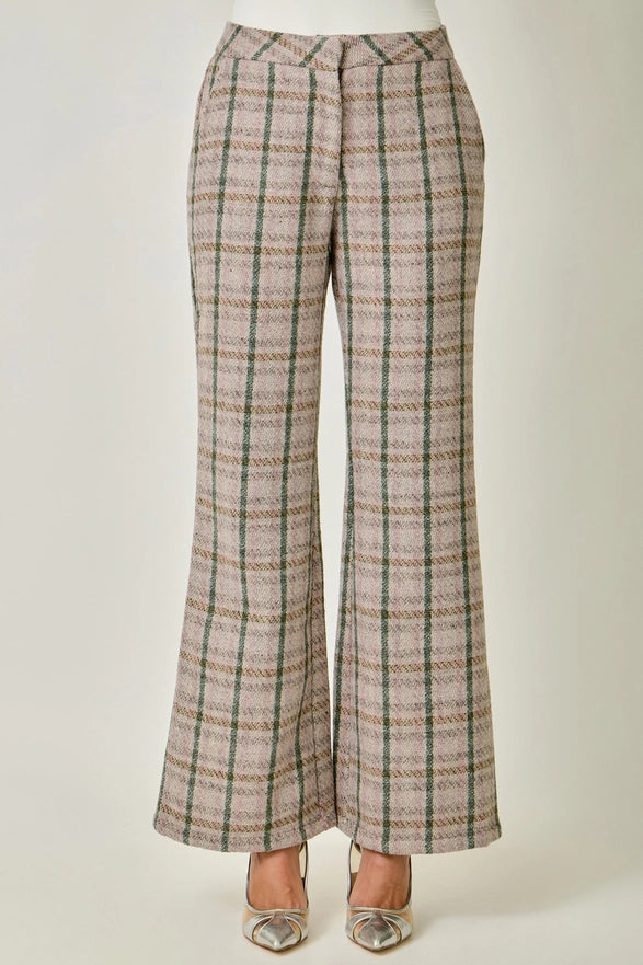Plaid pants on a mannequin against a white background
