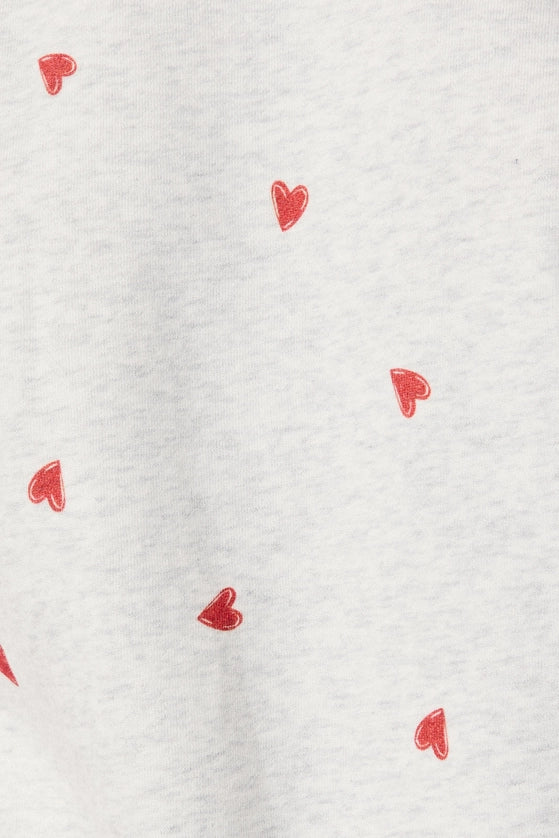 White fabric with small red heart patterns