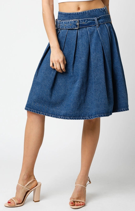 Blue denim skirt worn by a person on a white background