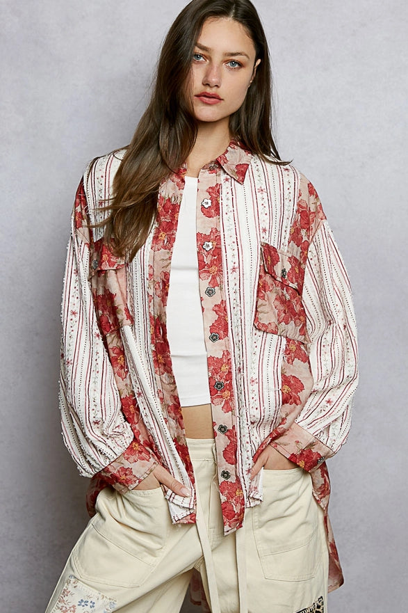 Woman wearing a floral blouse with a plain background