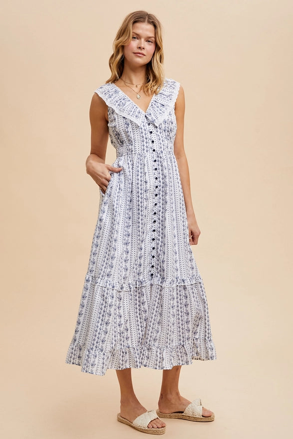 Woman wearing a sleeveless dress with lace details on a beige background