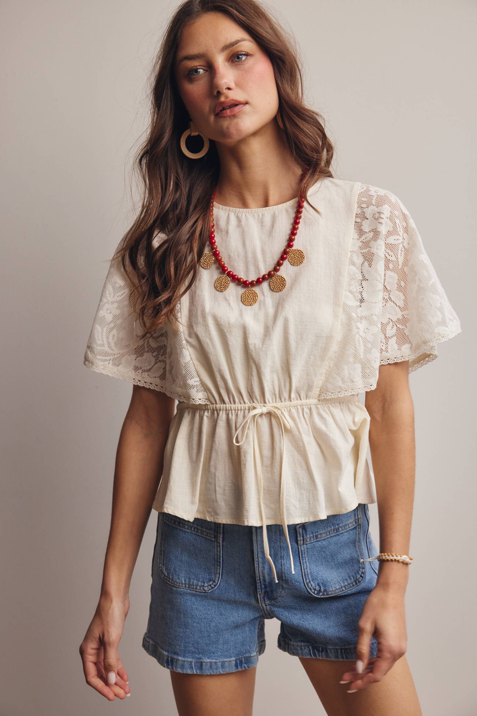The Iris Peplum Top