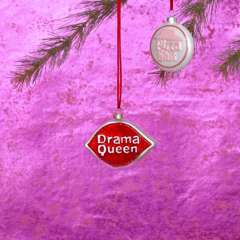 Decorative ornament with 'Drama Queen' text on a pink background