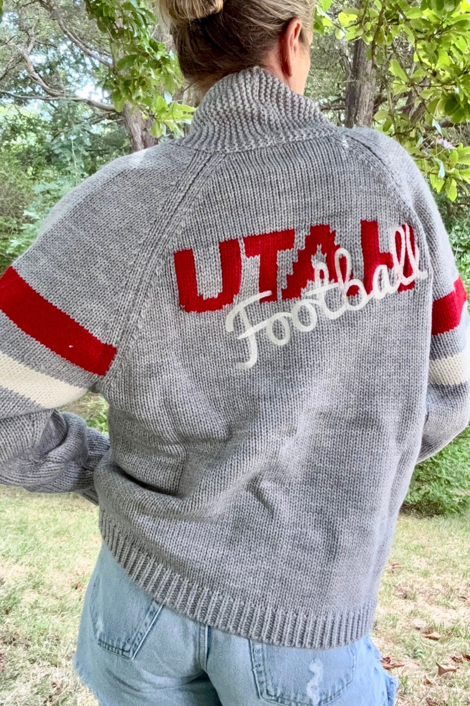 woman wearing vintage university of Utah cardigan.