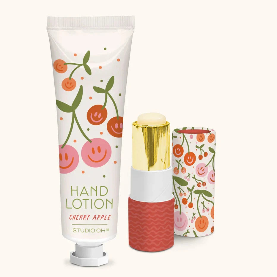 Hand lotion with cherry design and matching tube on a white background