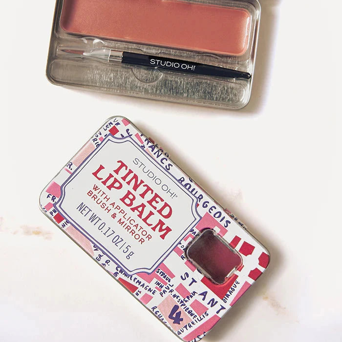 Lip balm and blush set with open case on a white background