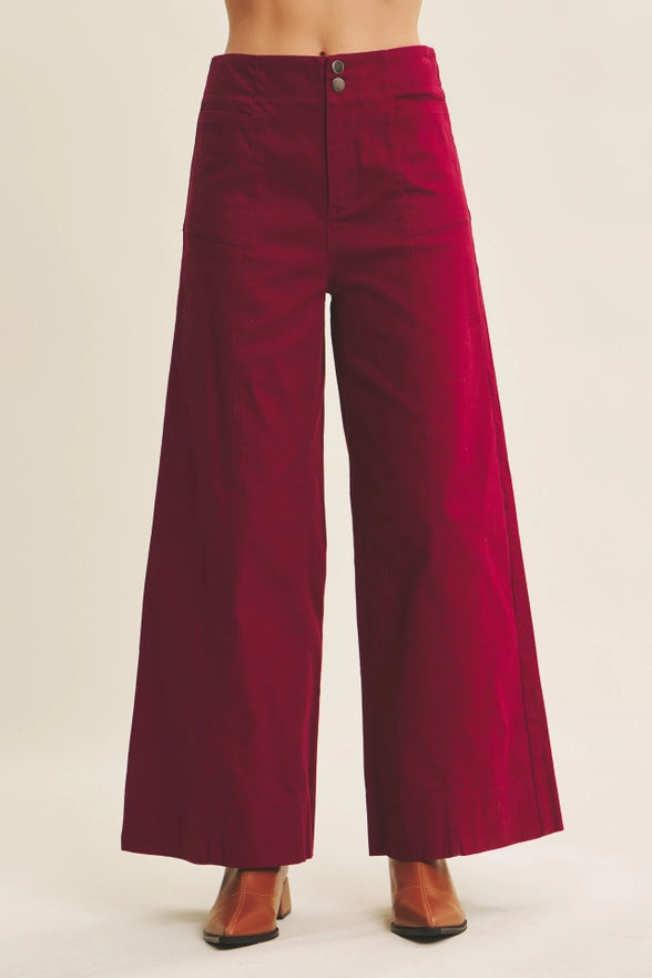 Red wide-leg pants on a plain background