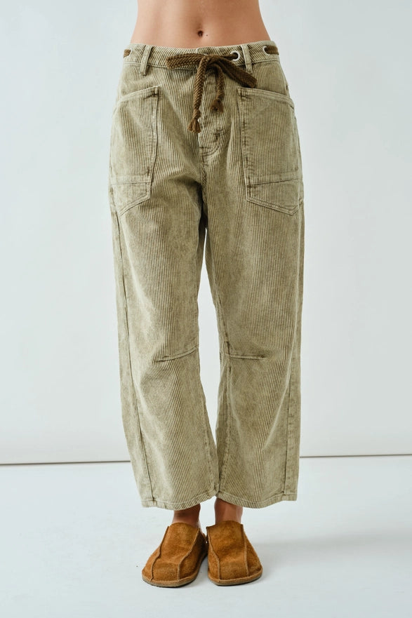 Light brown corduroy pants with a drawstring on a white background