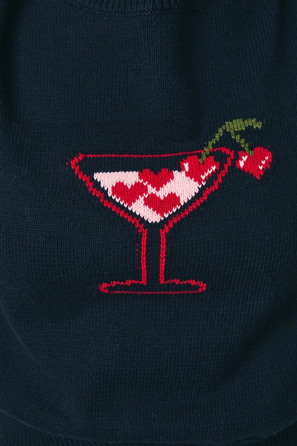 Navy blue sweater with a martini glass design featuring hearts and cherries.