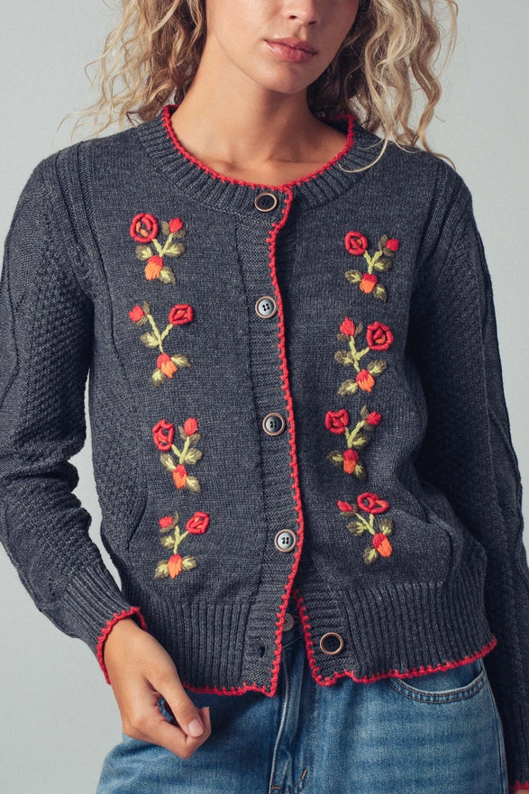 Dark gray cardigan with floral embroidery on a plain background
