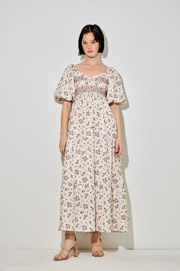 Woman wearing a floral dress on a white background
