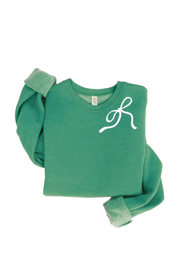 Green sweater with a white bow design on a white background
