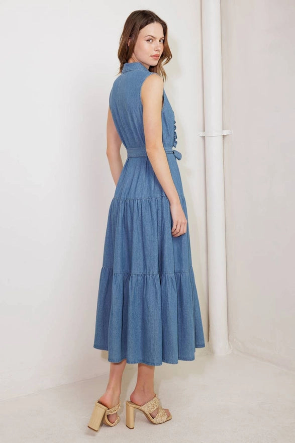 Woman wearing a blue dress against a white background