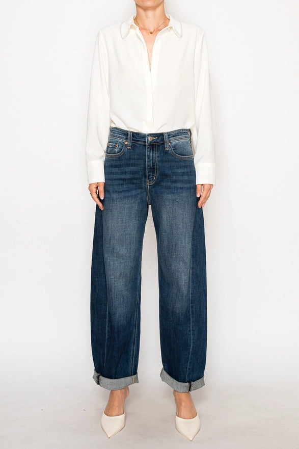 Person wearing a white shirt and blue jeans on a white background