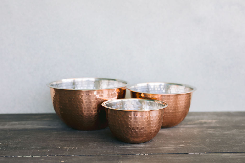 Product shoot of different sizes of the hammered copper bowl.