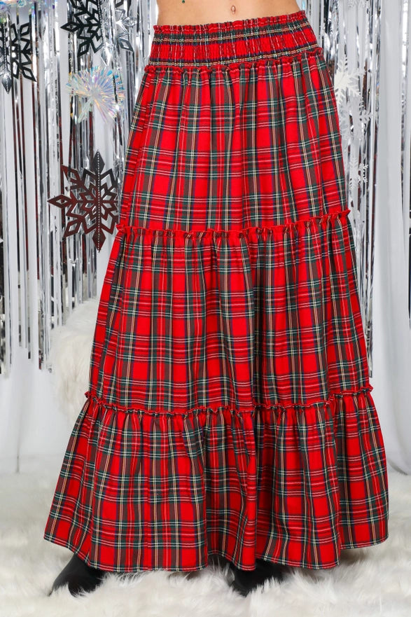 Red plaid skirt with a black and white patterned background