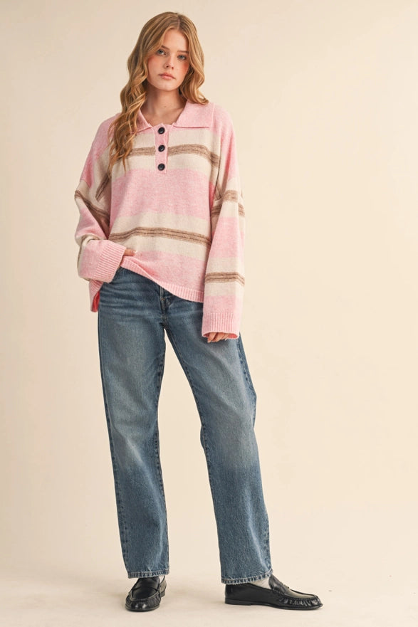 Woman wearing a pink plaid shirt and blue jeans on a beige background