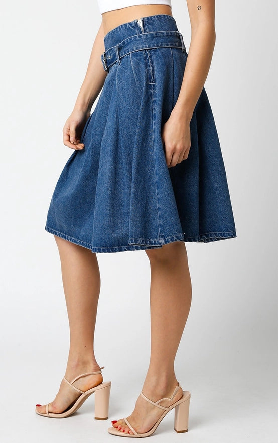 Denim skirt worn by a person on a white background