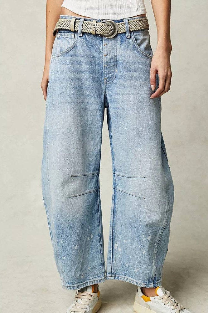 Wide-leg jeans worn by a person on a neutral background